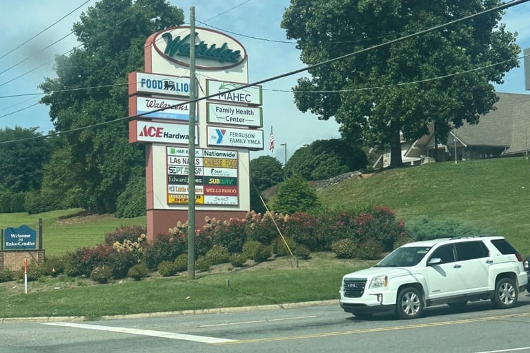 White GMC parked at light beside Westridge sign representing Candler, NC auto locksmith services-lockout, ignition repair