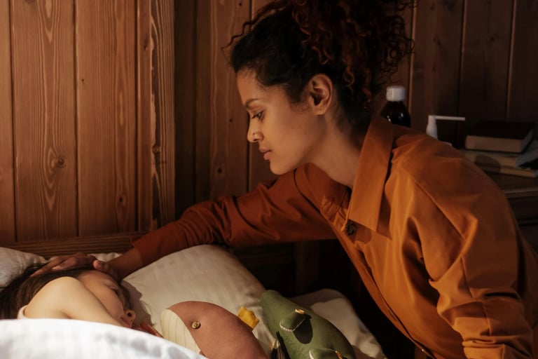 Maya tucking her kid in bed before working on her side hustle.