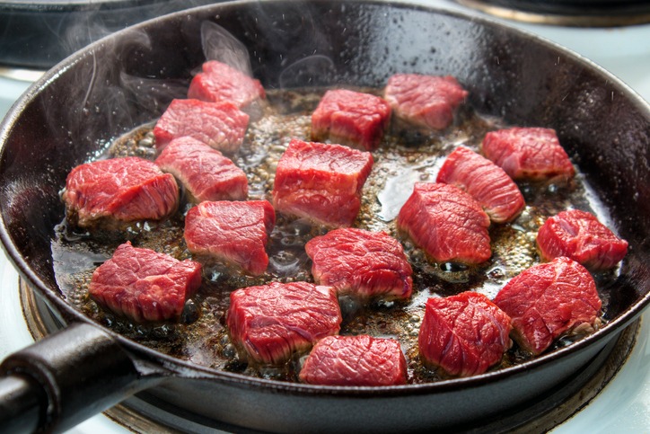 Grass Fed beef cooking in skillet