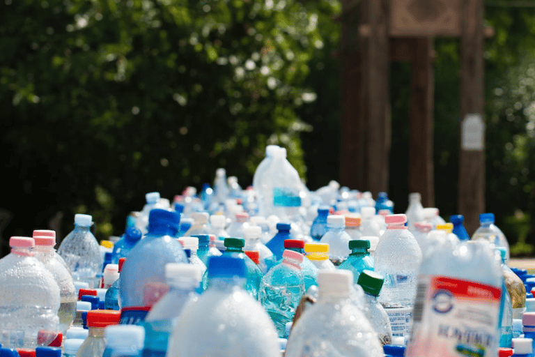 A table with plastic bottles of water 