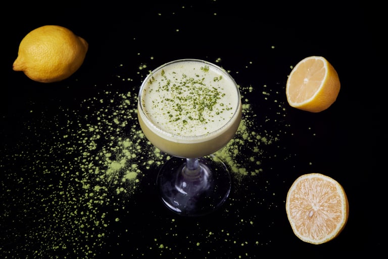 Ingredients for Creamy Matcha cocktail: gin, lillet, matcha syrup, lemon juice, and egg white