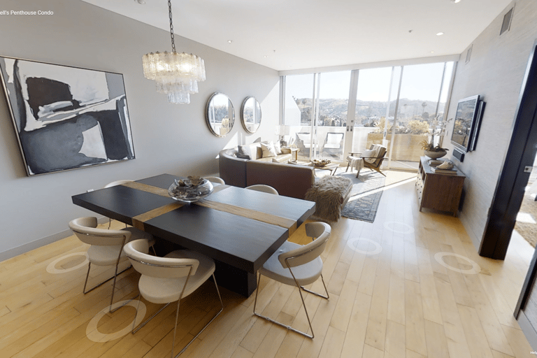 An interior residential Matterport view of the living room and dining room of a condominium