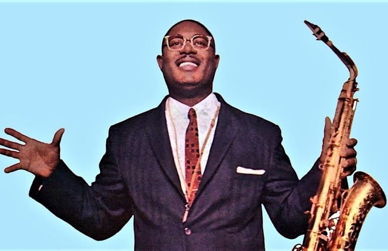 Photograph of musician Earl Bostic holding a saxaphone