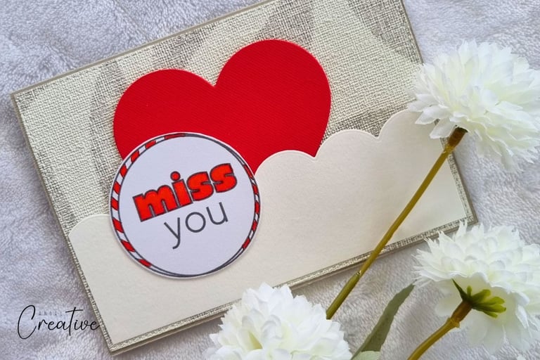 Handmade greeting card with red "Miss you" sentiment and big red heart on it.