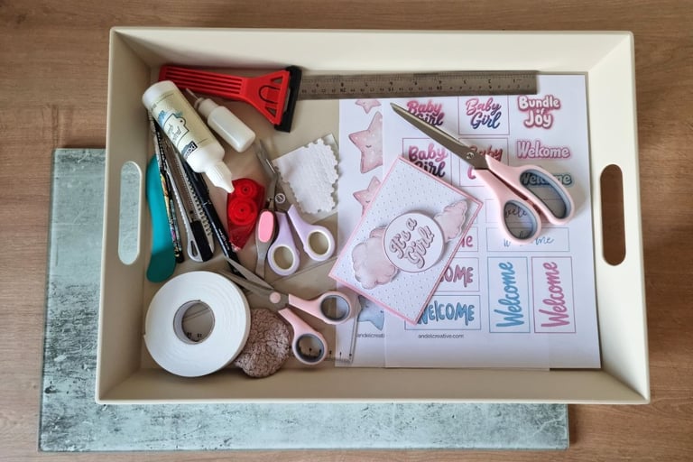 A tray with basic card making tools and printables for handmade greeting cards