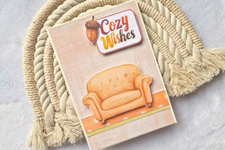 Handmade fall greeting card with a sofa and "Cozy Wishes" sentiment on it.