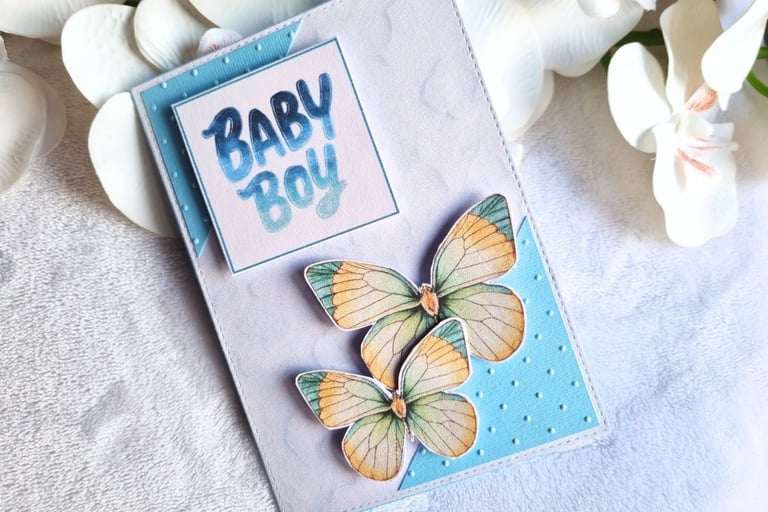 Handmade new baby card with butterflies. Blue colors.