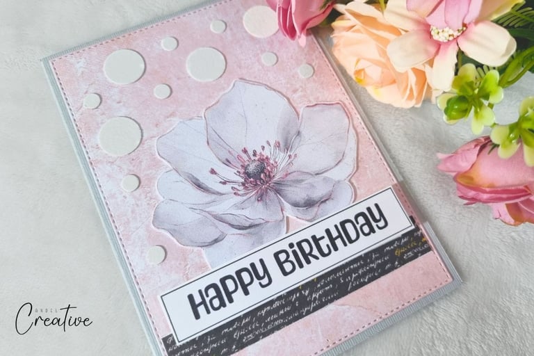 Handmade greeting card with big flower, pink background, white dots and Happy Birthday sentiment