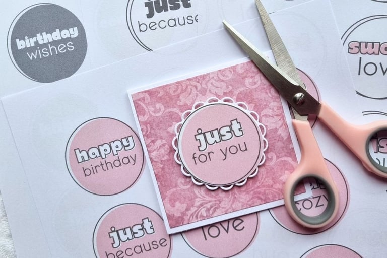 Printed sheets with circular sentiments on them, pink handmade card with "Just for You" sentiment.