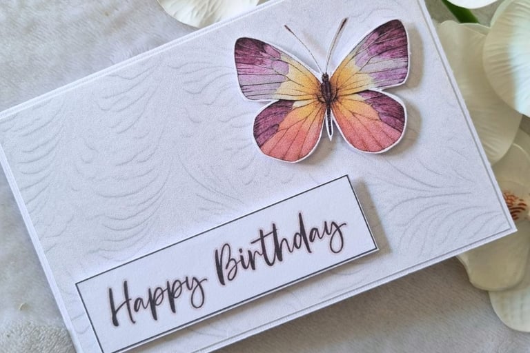 Simple handmade greeting card with colorful butterfly and "Happy Birthday" sentiment