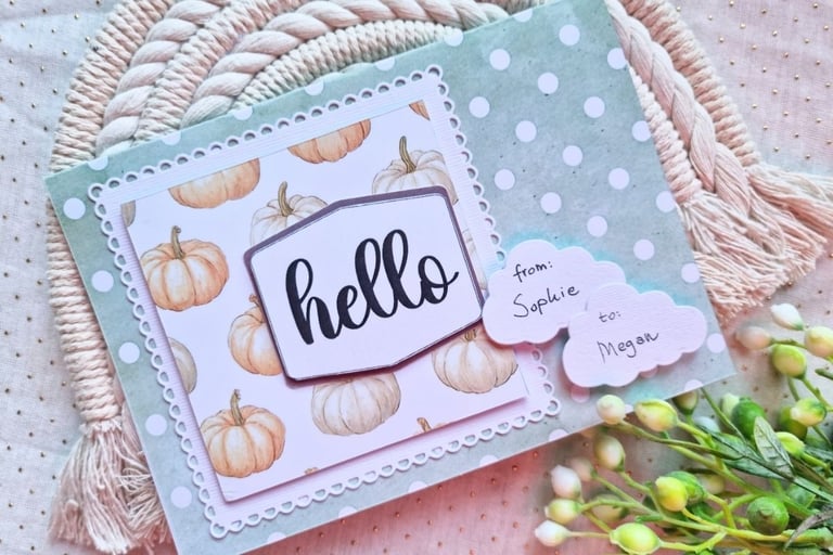 Handamde greeting card with dots, pumpkins and "Hello" sentiment on a beige background. Crafty vibe.
