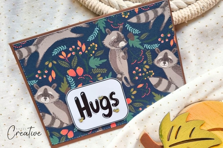 Fall themed handmade card with racoons and "Hugs" sentiment. Card making vibe.