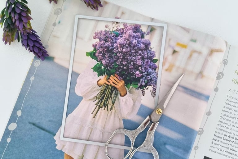 A magazine page of a person in a white dress holding a large bouquet of purple flowers.