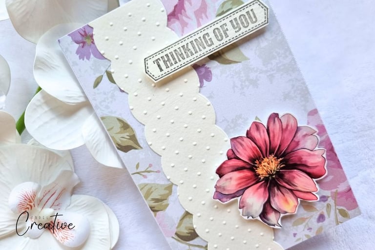 handmade greeting card with floral background, a pink flower and sentiment "Thinking of You"