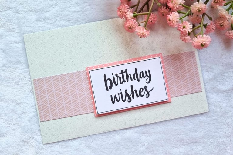 handmade greeting card in cream and pink colors, with "Birthday Wishes" sentiments on it