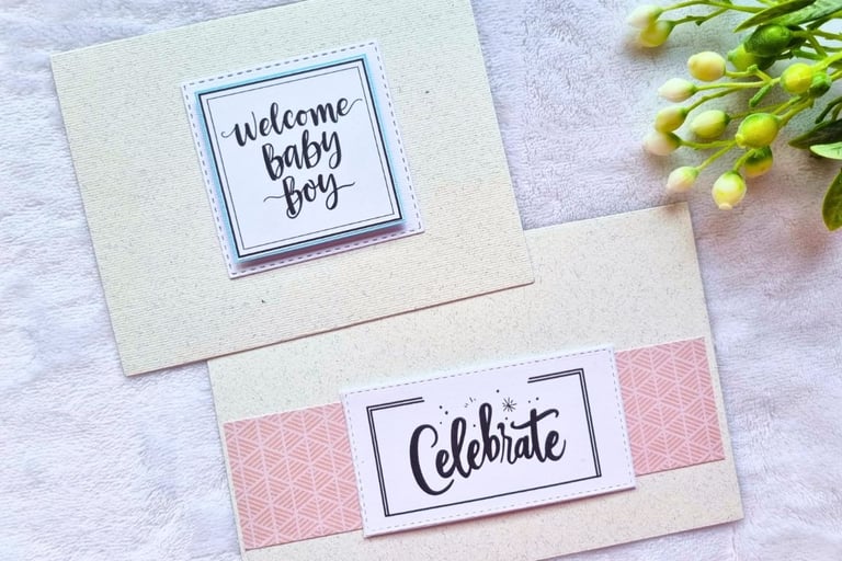Two handmade greeting cards with "Celebrate" and "Welcome Baby Boy" sentiments on it