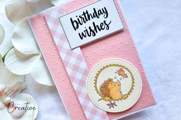 handmade card with pink embossed background, hedgehog stamps and "birthday wishes" sentiment