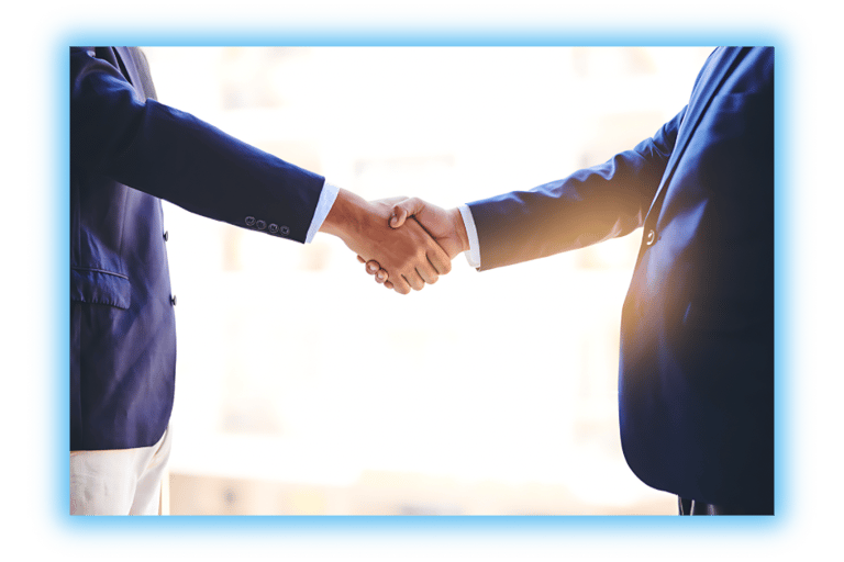 Two business men shaking hands with the sun shining in the background