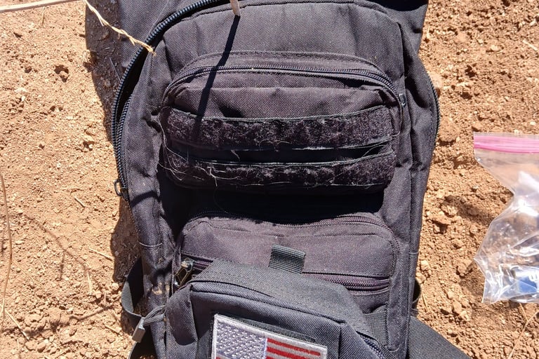 tactical style hydration backpack being used for mountain biking