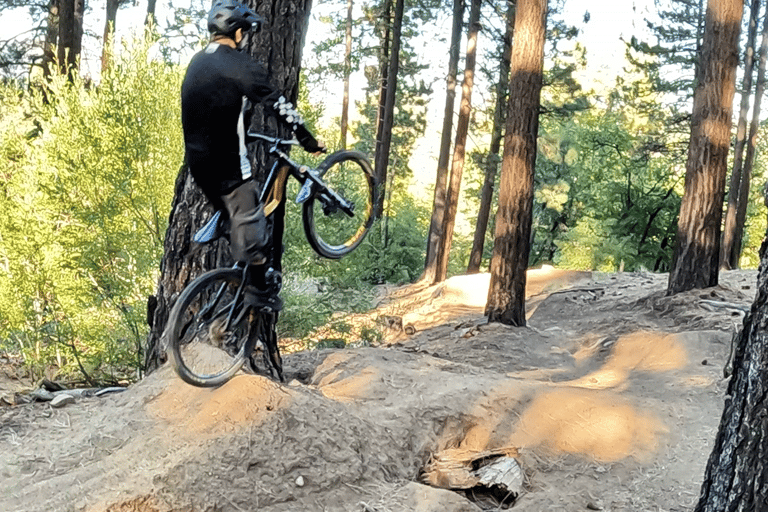 Mountain biker extending off the top of a jump with proper form