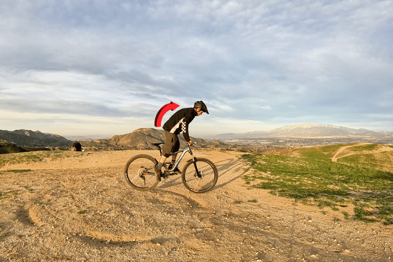 rider shifting weight forward to lift back wheel for rear wheel lift