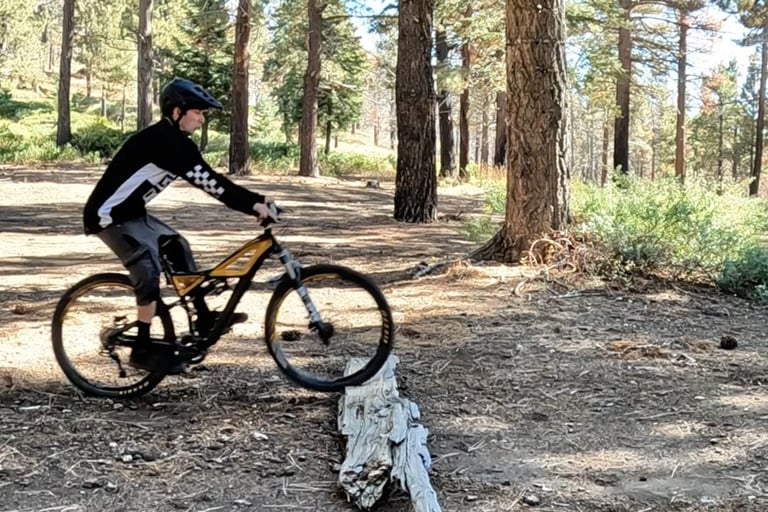 mountain biker about to do a bump jump