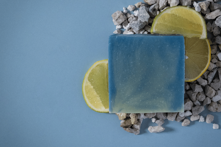a soap bar with a slice of lemonade on top of a pile of rocks