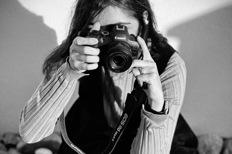 a woman taking a picture of herself taking a picture of herself