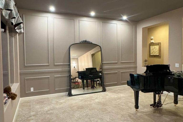 At Hand Heroes created custom wall with paint and can lights in North Peoria Home