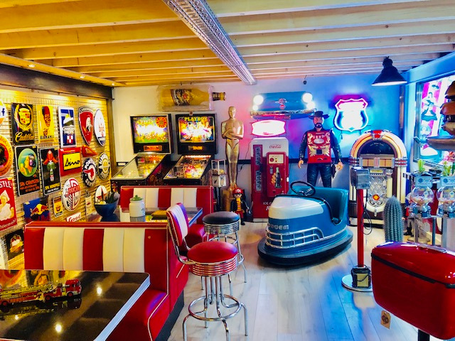 a room with a lot of arcade machines,arcade machines