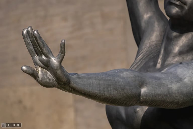 Close-up of the hand with a delicate gesture of the gymnast girl from Dezső Győri’s 1958 statue.