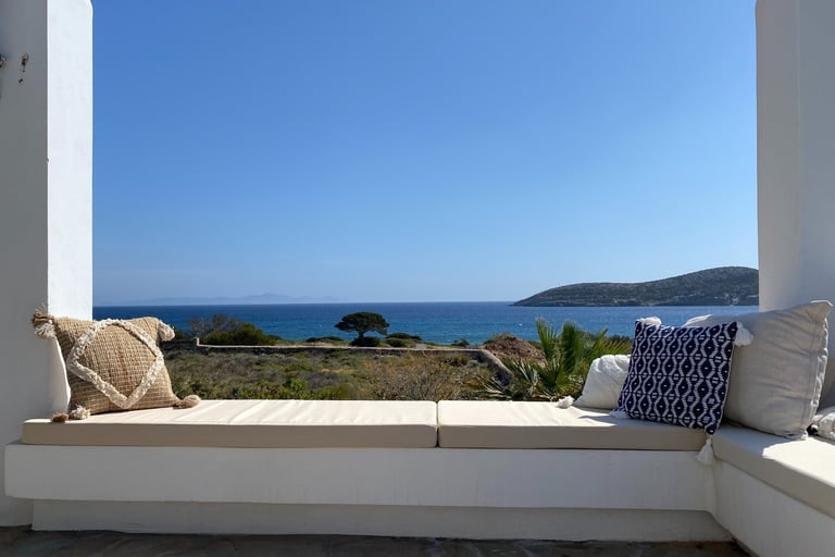 a couch with pillows and pillows on a sunny day