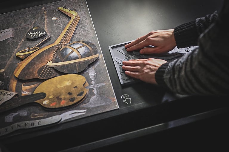 An interactive magnetic board and a raised image.