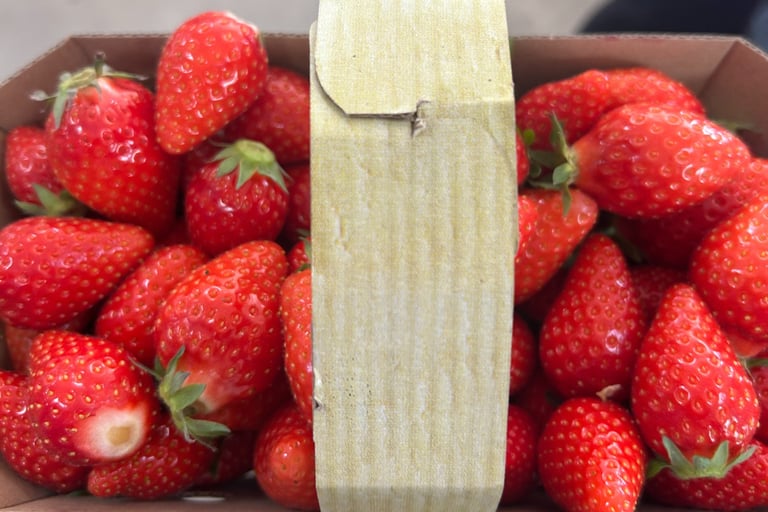 a box of strawberries in a cardboard box