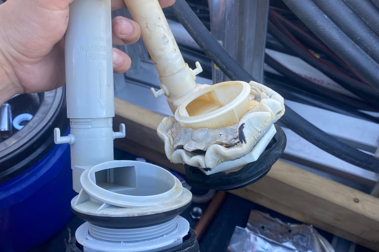 Worn out flush valve on the right compared to new one on the left