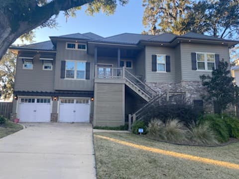 a house with a driveway and garage door