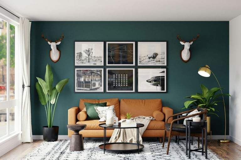 Urban living room with bold green accent wall, camel-colored leather sofa and wall photo gallery.