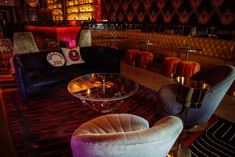 The Eighth Room lounge in Nashville with Gucci wallpaper, Versace furnishings, and Viation’s discree