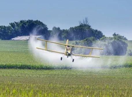 Plane spaying poison on our fields