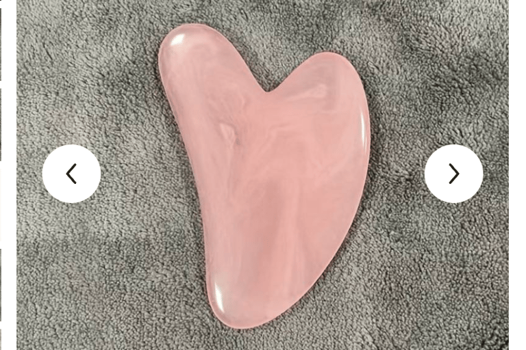 a pink heart shaped object on a carpet