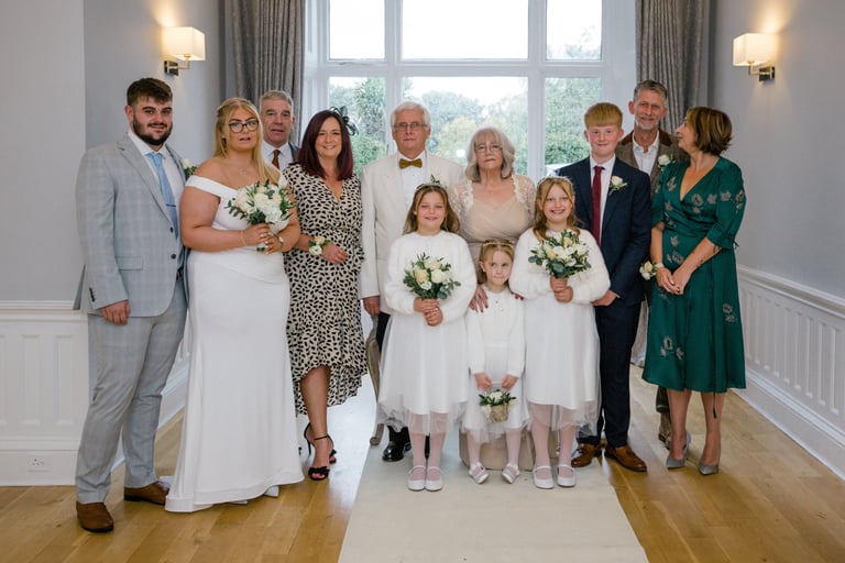 Family Photograph At The End Of Their Renewal Of Vows Ceremony