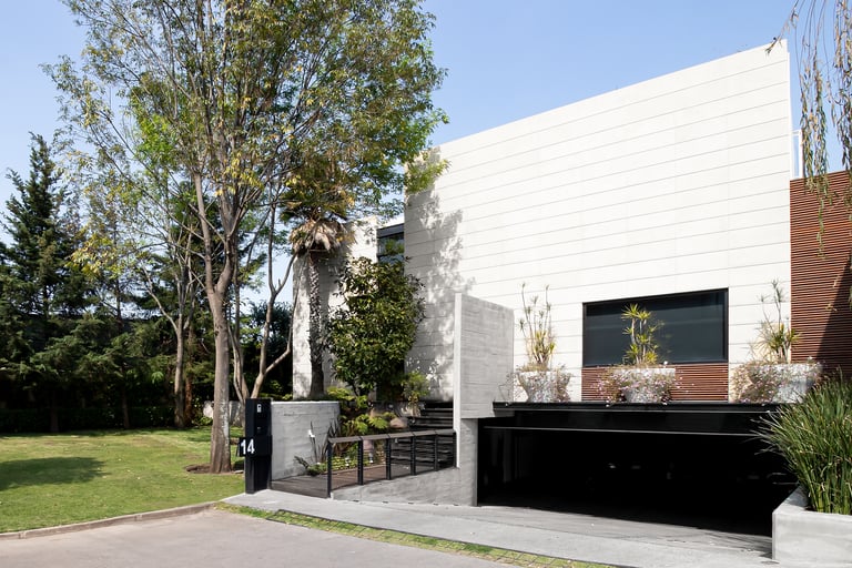 a building with a large white building with a black door