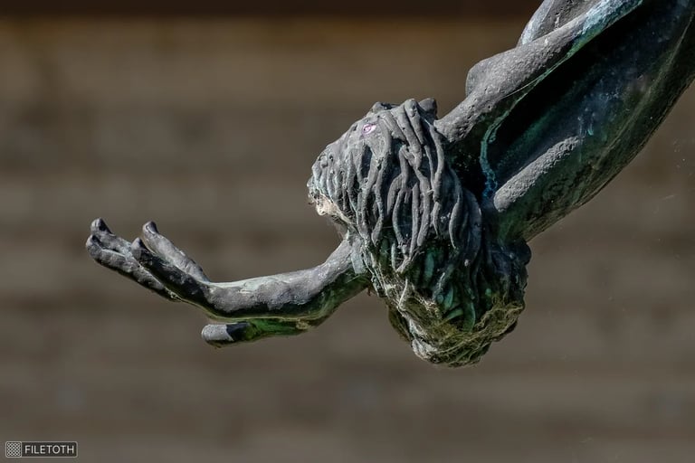Left hand of Manyi Kiss in a sunlit, elegant, fairy‑like gesture.