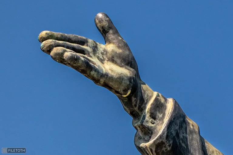Lenin’s raised hand, fingers extended in a directive gesture.