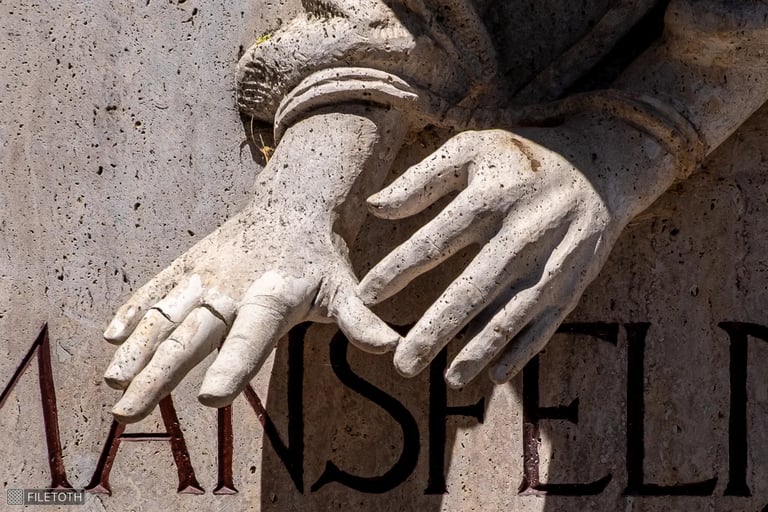 Close-up of Péter Mansfeld's handcuffed hands with outstretched fingers.