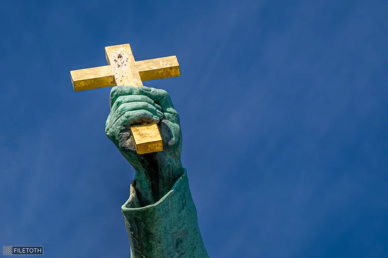 Hand lifting the cross skyward, metal glowing in direct sunlight.
