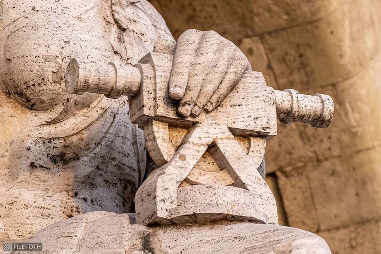 Close-up of the hand of the statue representing mechanical engineering at the TUB entrance.