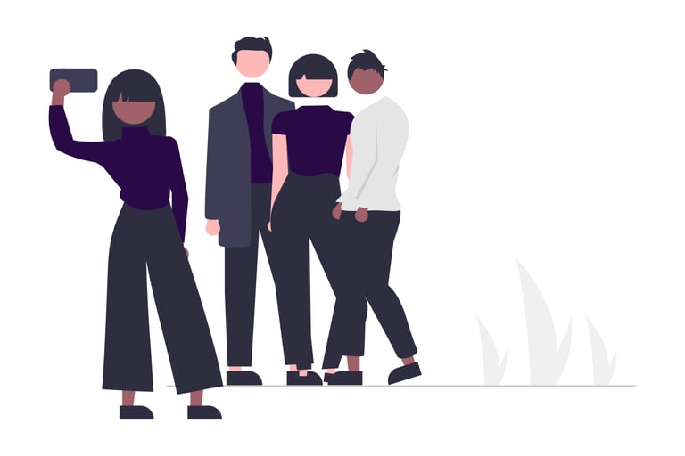 Woman holding cell phone to take a selfie of herself and a group of people or her founders group.