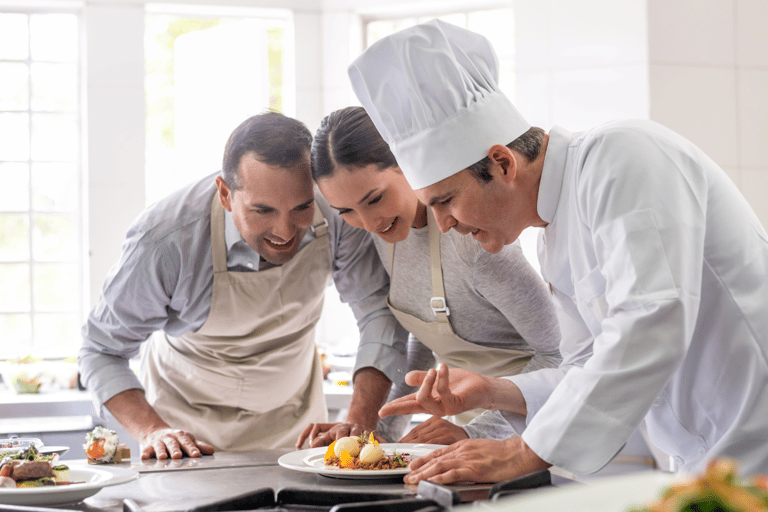 Couple taking a cooking class with personal chef