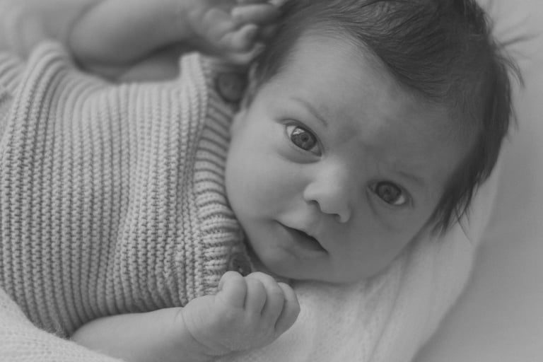 newborn baby looking up at camera, taken in Adelaide studio